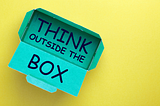 Blue “Think outside the box” image against a yellow background.