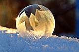 beautiful detail of bubble with leaf reflection