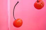 Two cherries falling down