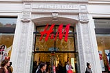 Image of H&M storefront, with logo as the focal point