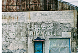 Patina warehouse building Bywater New Orleans Must I Evolve? by Andrew H. Housley