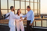 Corporate client greeting beekeepers
