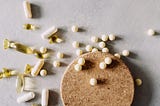 Aesthetic stock image showing a flatlay of supplements on a table. The image is purely for decorative use only to support the article on whether supplements actually work or if they’re just another viral wellness trend