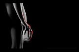 Naked woman from the back holding an empty glass with blood dripping off her fingers