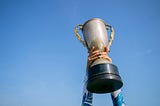 Person holding trophy