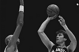 Frank Brickowski, nicknamed “Brick,” shoots over Kareem Abdul-Jabbar.