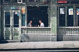 Two people talking in a cafe