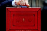 A hand holding the famous ‘red box’,  which includes the name Chancellor of the Exchequer.