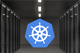 Picture of the Kubernetes logo in a data center