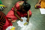 A child drawing her ‘superhero mask’