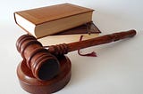 IMAGE: A judge’s gavel and a couple of books