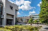 the roger stevens building and pond on the university of leeds campus