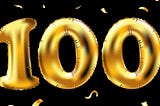 “100” written in large gold balloons with gold confetti