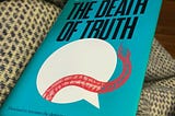 A copy of the Book The Death of Truth by Michiko Kakutani.