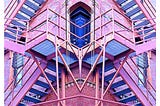 Pink building with geometric fire escapes.