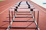 Hurdles lined up on a running track