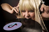 Lady listening to music while biting a vinyl record that has the TikTok logo on the top.