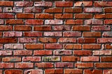 a graphic with a brick wall