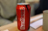 A can of Coca Cola with the word “boofhead” on it.