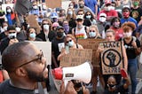 ‘Just step one.’ With cops by their side, hundreds protest for George Floyd in Macon