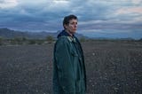 Fern, played by Frances McDormand, stands in the desert in a frame from ‘Nomadland’