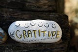 Rock with the word printed “gratitude”