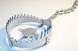 A bear trap representing the traps to avoid when buying online courses.