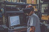 man with VR headset on, workshop background, 2023 technology trends