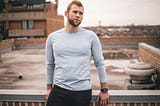 A guy standing at the rooftop.