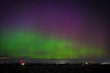 The Aurora Borealis — hues of green, pink and purple dance across the night sky