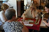 Four women playing Mahjong