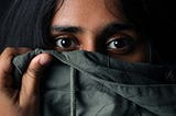 woman covering part of her face