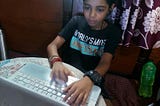 A boy using laptop