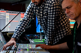 Broadcast engineers work in studio