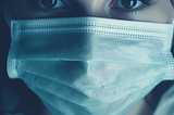 Close-up of a woman wearing a baggy surgical mask that does not prevent transmission of airborne viruses. Image created by Karistina Lafae using Midjourney.