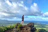 A photo of Sammy on top of a hike in Kauai overlooking the ocean