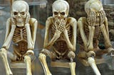 three skeletons in the hear no evil say no evil see no evil positions