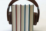 Headphones + books | Photo by sindrehsoereide from Pixabay