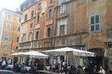 An outdoor restaurant patio in Rome, Italy.