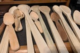 A stack of hand-carved spoons