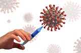 Image of a virus being pierced by a hypodermic needle