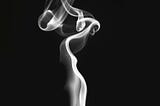 A black and white image showing smoke coming from a lid match