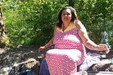 Photo of Devon J Hall showing her body, rolls, saggy breasts, and all