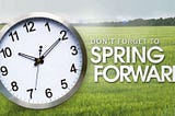 Clock with “Don’t forget to spring forward” message.