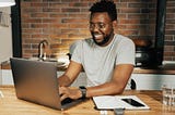 Black man using a laptop