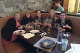 A group of women sitting at a table — Philly Pod’s FIRST meeting, March 19, 2017. From left to Right: Dr. Lexi Moore Crisp, Krista Heinlen, Tanya Dapkey, Rita Steed, and Meredith Bashaw.