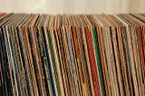 stack of vinyl albums