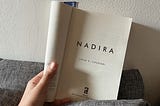 A hand holding book entitled Nadira written by Leila S. Chudori