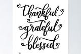 A poster that says “thankful grateful blessed” in curly font and hearts