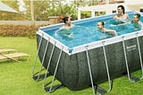 family enjoying in above ground pool